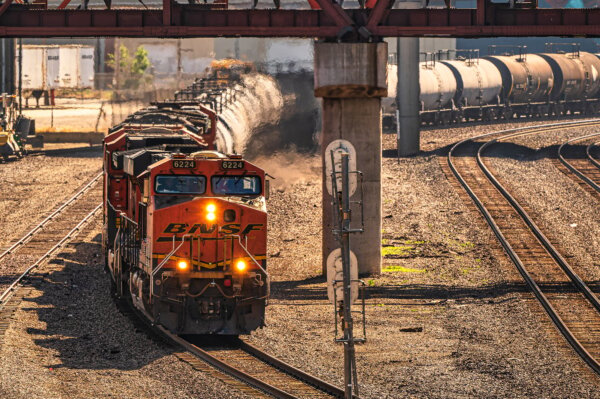 long-train-with-multiple-cars-on-its-tracks