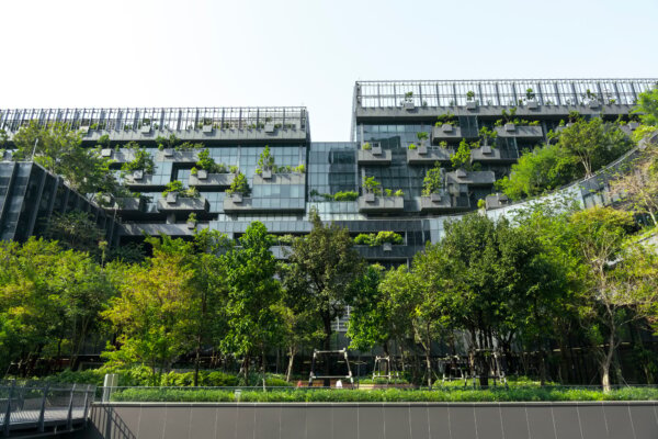 eco-friendly-building-in-modern-city-sustainable-glass-office-building-with-trees-for-reducing-co2-