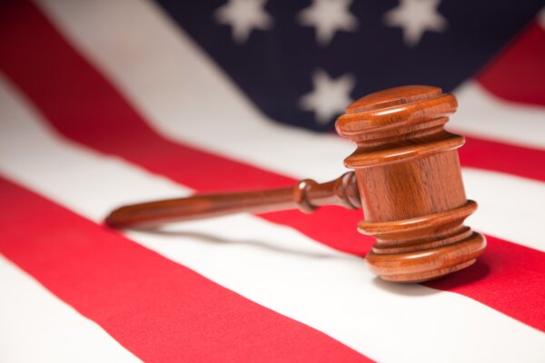 justice-gavel-resting-on-an-american-flag-1-1