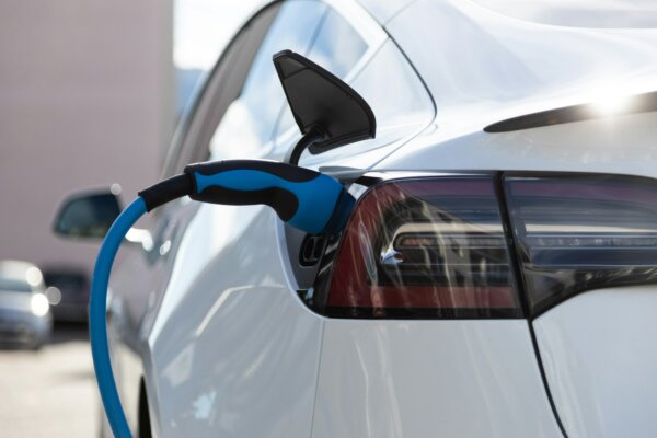 ev-electric-car-pluged-charging-at-a-recharge-station-in-the-city-1