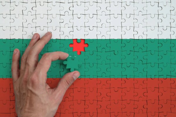 bulgaria-flag-is-depicted-on-a-puzzle-which-the-man-s-hand-completes-to-fold-