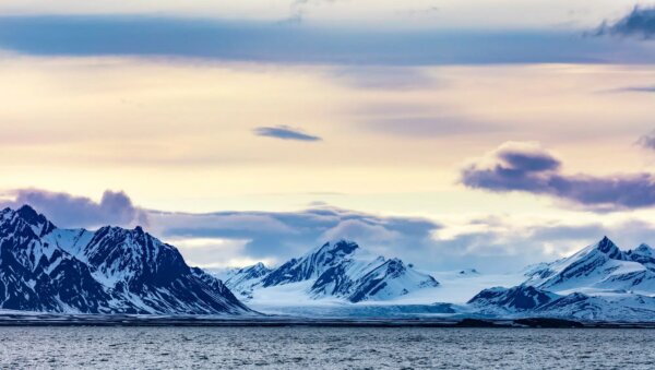clouds-over-snowy-mountains-and-glacier-in-the-arctic
